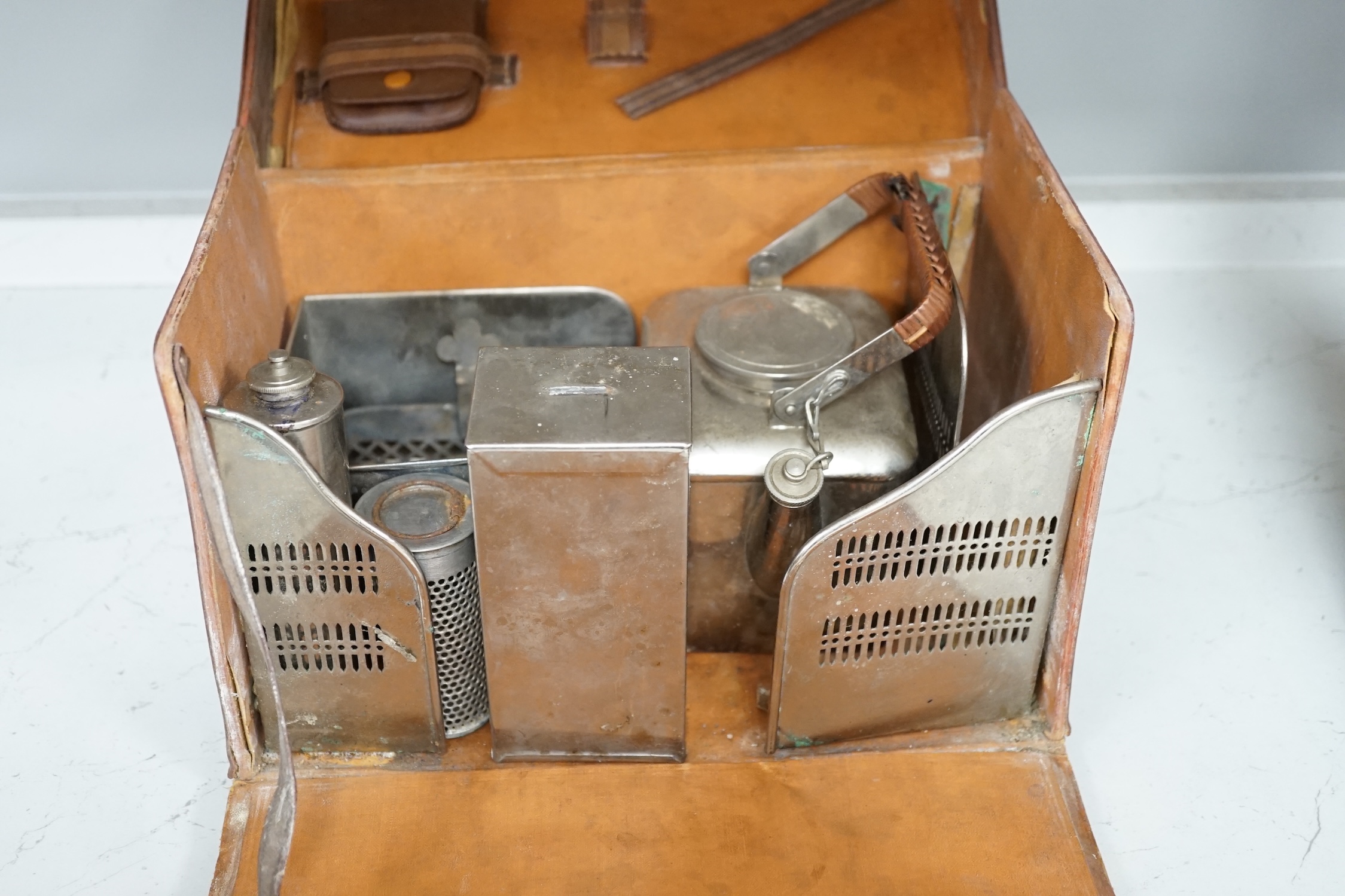 Two Savoy Hotel silver plated items comprising ice bucket and basket with swing handle together with a leather cased travelling picnic tea set. Condition - fair